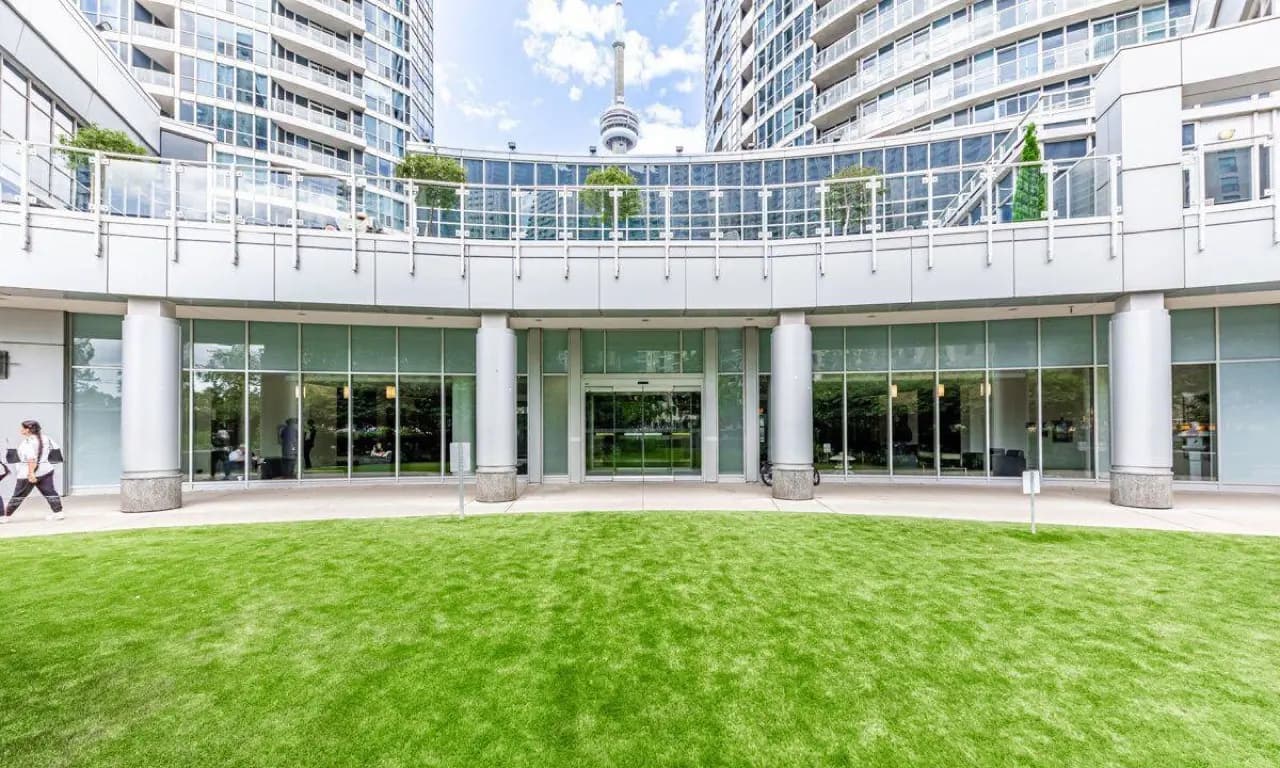 Toronto condo building entrance with manicured green lawn — strata and condo lawn care service
