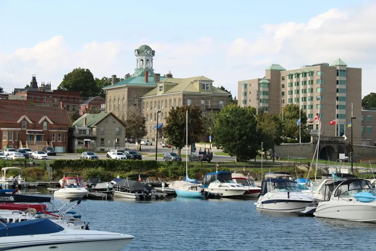Fredericton, New Brunswick harbour with clock tower and heritage buildings — lawn care service area