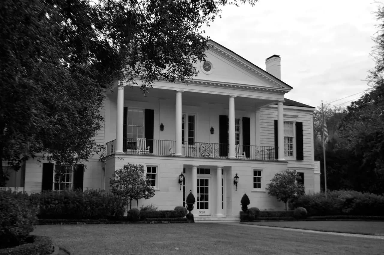 Residential home with beautifully maintained green lawn
